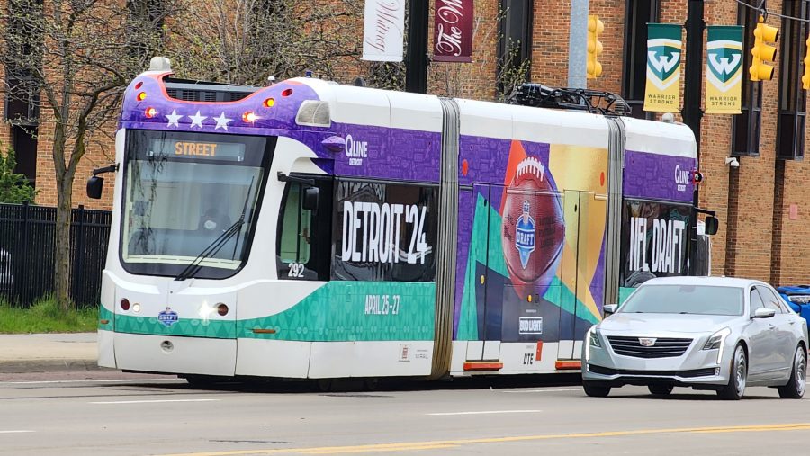 A QLine train wrapped in NFL Draft messaging.