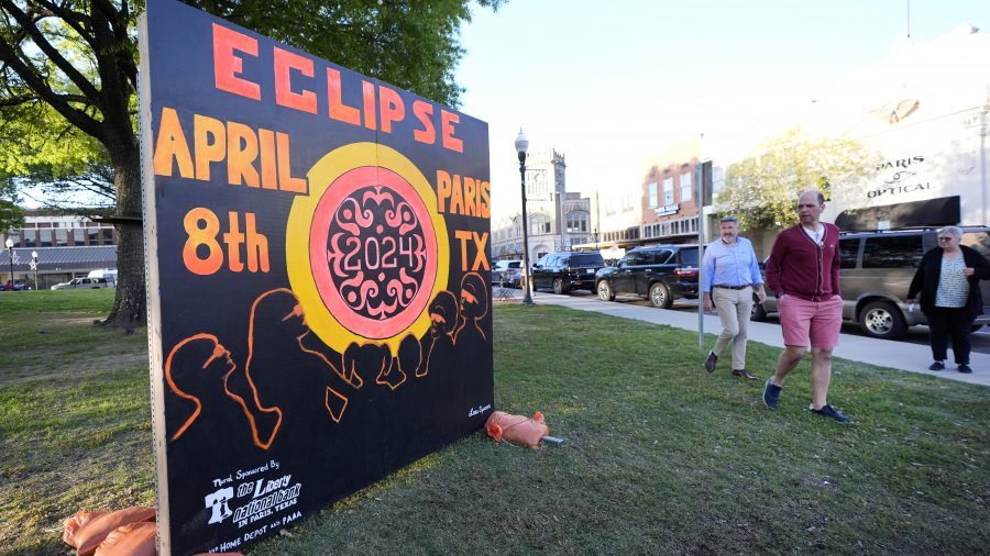 A sign in the town square greets visitors in Paris, Texas, Sunday, April 7, 2024. Paris is one of many small towns along the route where the eclipse can be observd from. (AP Photo/Tony Gutierrez)