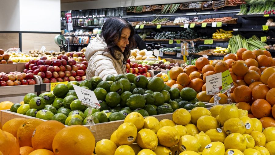 FILE - A woman browses produce for sale at a grocery store, Friday, Jan. 19, 2024, in New York.
