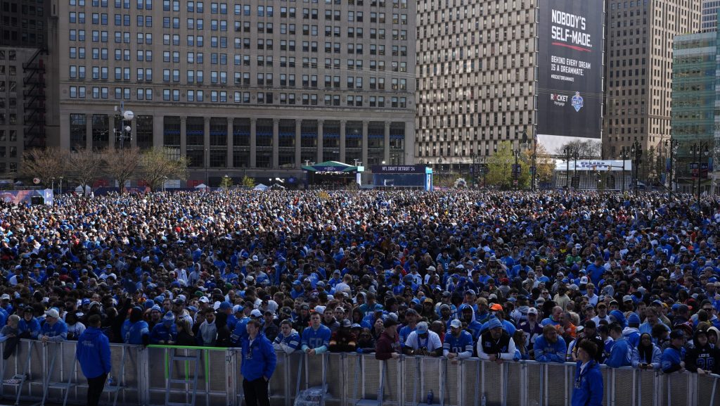 Fans wait outside of the draft theater ahead of the first round of the NFL football draft, Thursday, April 25, 2024, in Detroit.