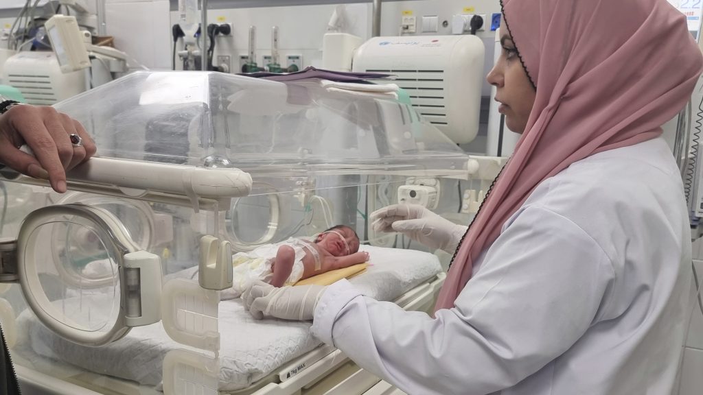 A Palestinian baby girl, Sabreen Jouda, who was delivered prematurely after her mother was killed in an Israeli strike along with her husband and daughter, lies in an incubator in the Emirati hospital in Rafah, southern Gaza Strip. Sunday, April 21, 2024. (AP Photo/Mohammad Jahjouh)