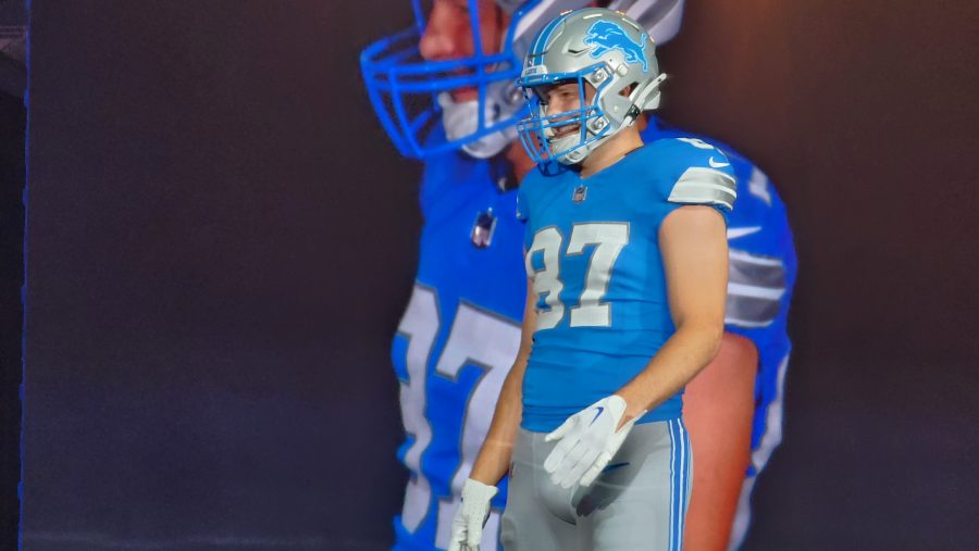 Detroit Lions tight end Sam LaPorta models the team's new uniform during a season-ticket holder event on April 18, 2024, at Ford Field in Detroit, Mich.