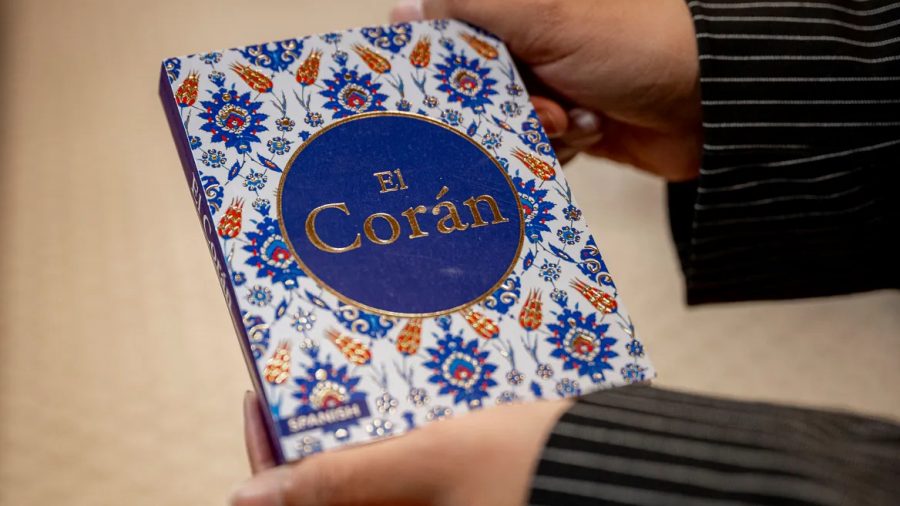 Janae Wilson shows a copy of a Spanish-language Quran.