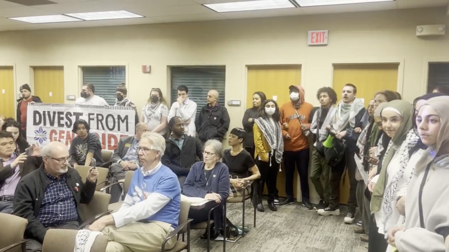 Pro-Palestinian protesters seeking university divestment from Israel disrupted a Wayne State University Board of Governors meeting on Friday, April 26, 2024, resulting in their removal from the meeting.