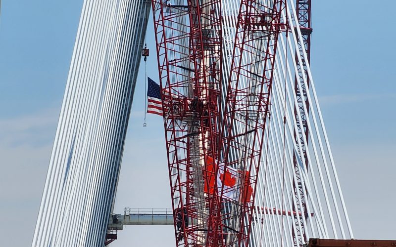 Flags fly from cranes on the American and Canadian sides of the international span.