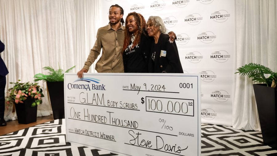G.L.A.M Body Scrubs owner Tiffany Cartwright poses with her son and mother after being awarded the $10,000 Comerica Hatch Detroit grand prize on May 9, 2024, in Detroit.