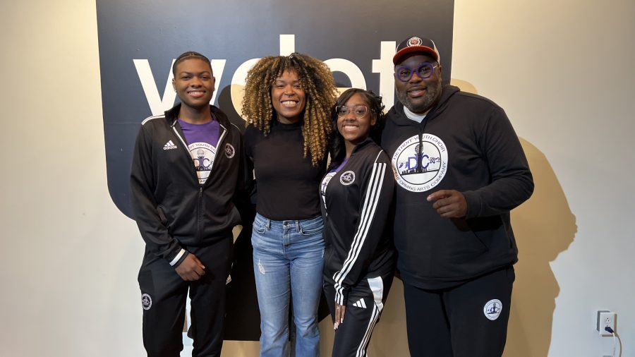 The Metro co-host Tia Graham posing with members of the Detroit Youth Choir.