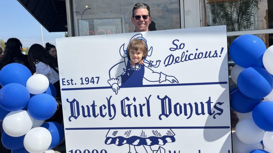 Ferndale resident Chris Dempsey poses with his granddaughter, Noa Molnar, outside the Dutch Girl Donuts shop on Saturday, May 4, 2024.