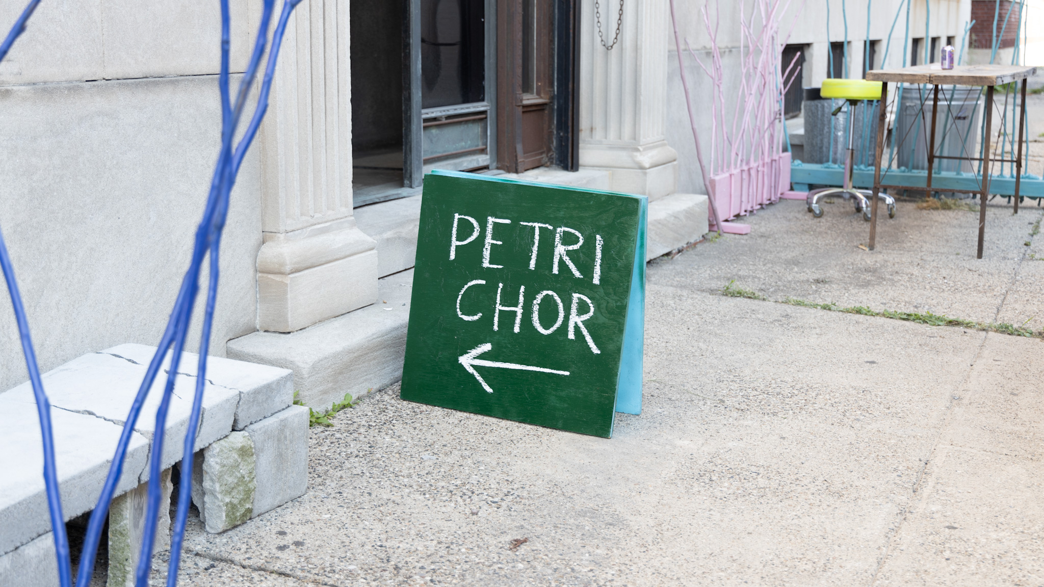 A sign set outside the Boyer Campbell Building in Detroit for the Petrichor botanical art installation on May 30, 2024. (Photo credit: Tayler Simpson, WDET)
