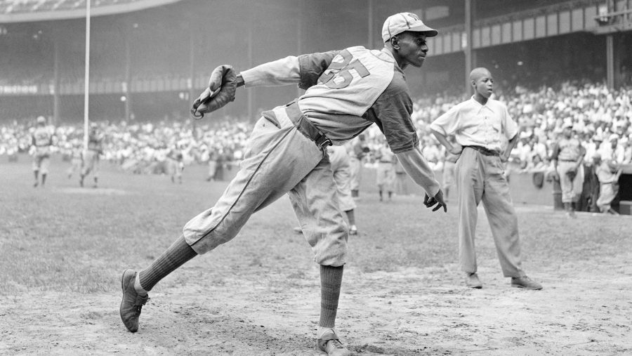 FILE - In this Aug. 2, 1942, file photo, Kansas City Monarchs pitcher Leroy Satchel Paige warms up at New York's Yankee Stadium before a Negro League game between the Monarchs and the New York Cuban Stars.