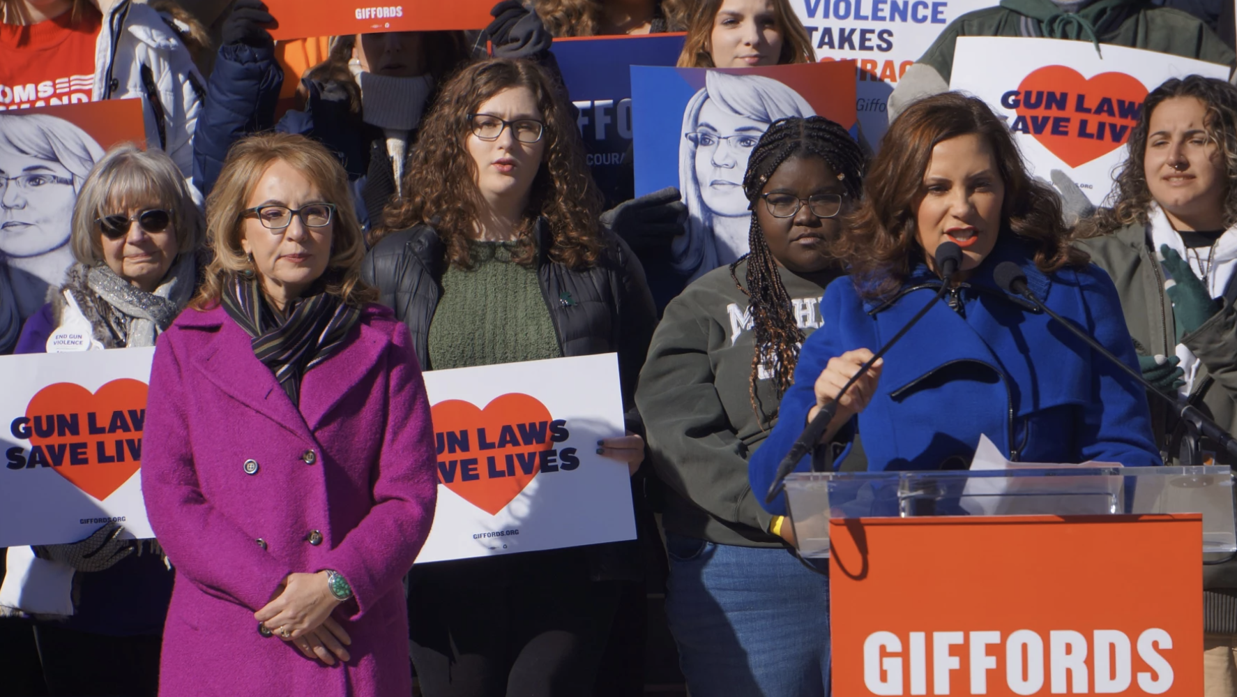FILE - Former Congresswoman Gabby Giffords watches as Gov. Gretchen Whitmer says she will sign gun safety bills once they are sent to her by the Legislature in March 2023.