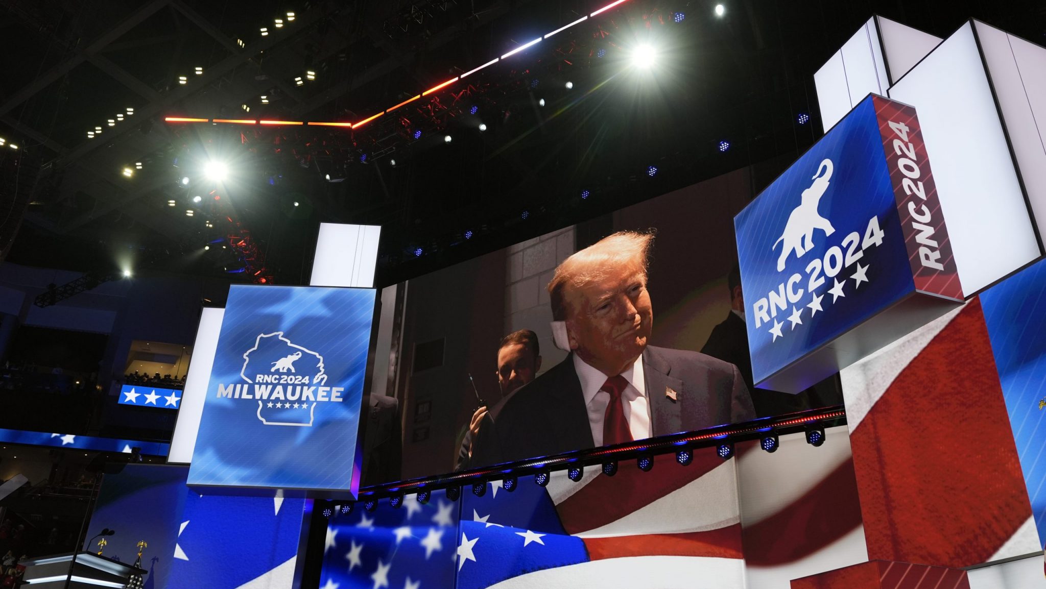 Republican presidential candidate former President Donald Trump is seen on a video monitor as he arrives to attend the first day of the Republican National Convention, Monday, July 15, 2024, in Milwaukee.