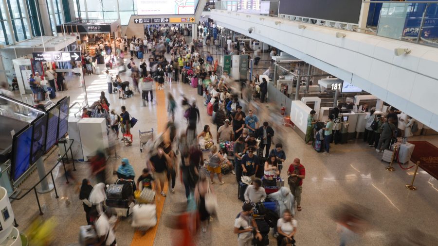 Passengers crowd the International flights departure terminal of Rome's Fiumicino airport, Friday, July 19, 2024, as many flights have been delayed or cancelled due to the worldwide internet outage.