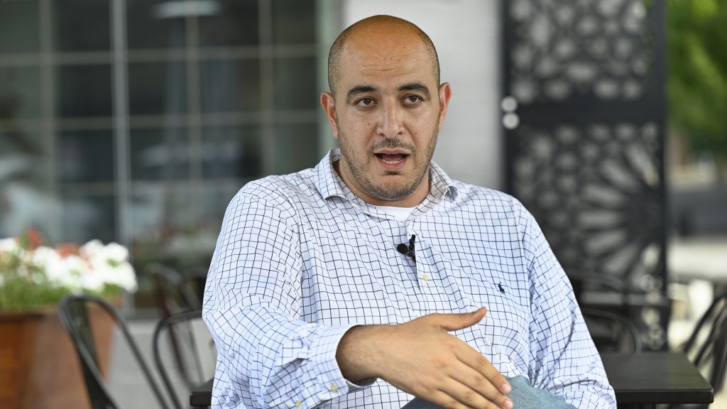 Uncommitted delegate to the Democratic National Convention Abbas Alawieh answers questions during an interview Wednesday, Aug. 14, 2024, in Dearborn, Mich.