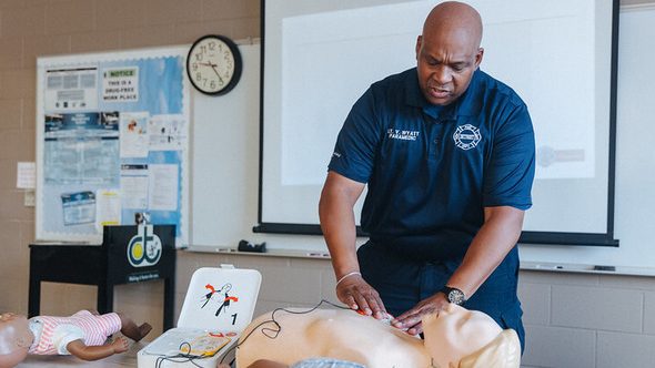 Detroit Fire Department Training Division Lt. Virgil Wyatt teaches DDOT employees how to correctly use the AEDs.