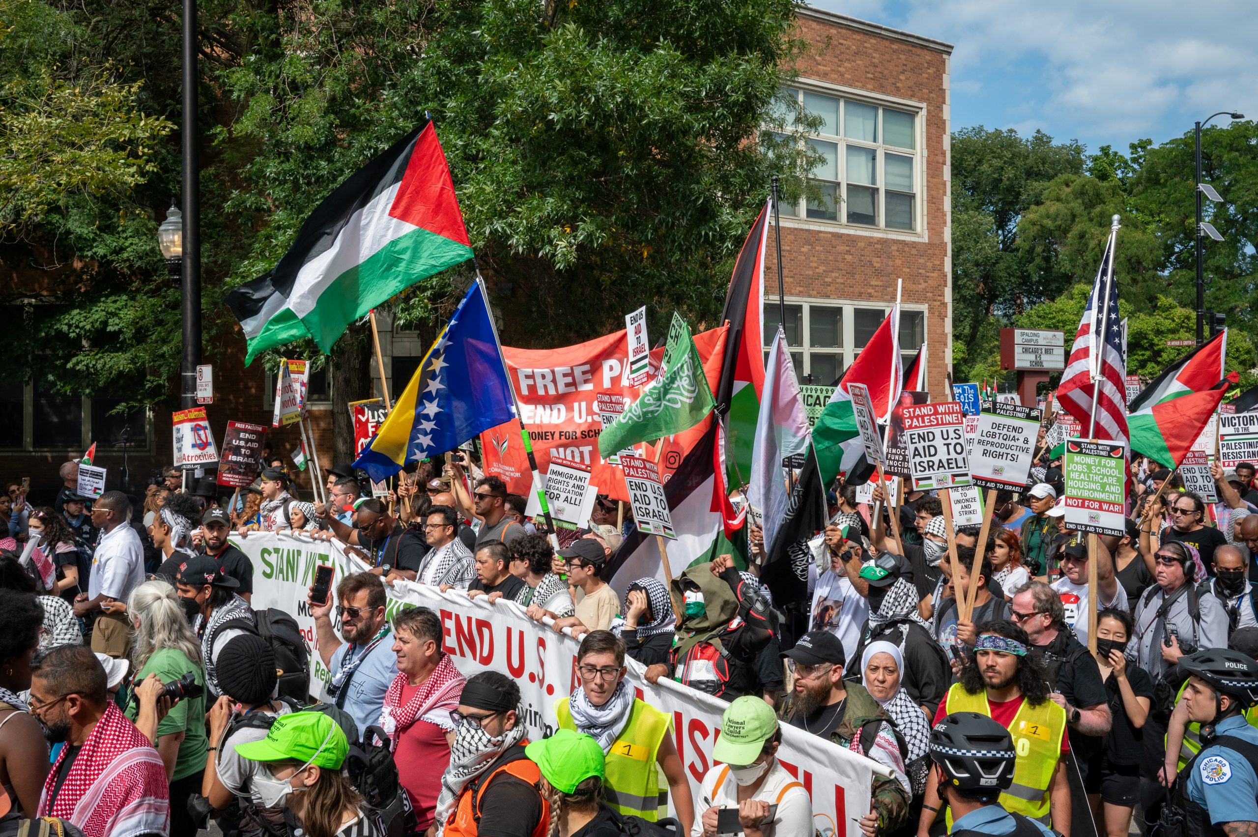 Pro-Palestinian and anti-war demonstrators march outside the Democratic National Convention in Chicago on Monday, Aug. 19, 2024.