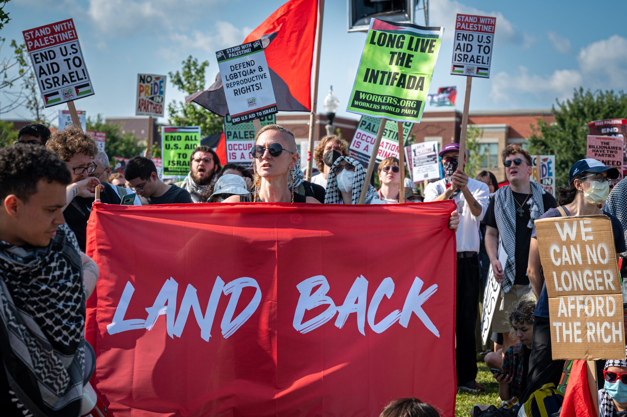 Pro-Palestinian and anti-war demonstrators march outside the Democratic National Convention in Chicago on Monday, Aug. 19, 2024.