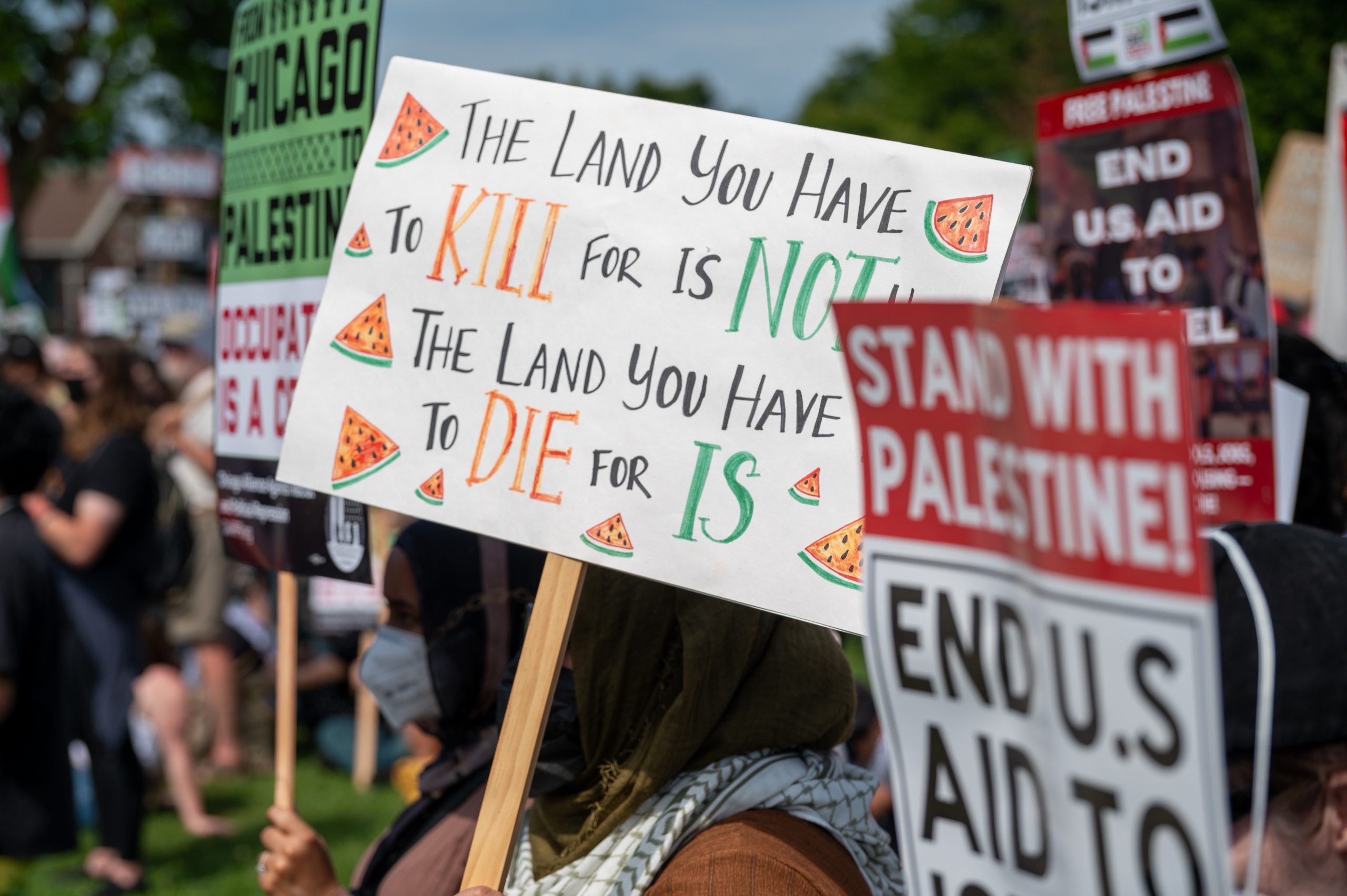 Pro-Palestinian and anti-war demonstrators march outside the Democratic National Convention in Chicago on Monday, Aug. 19, 2024.