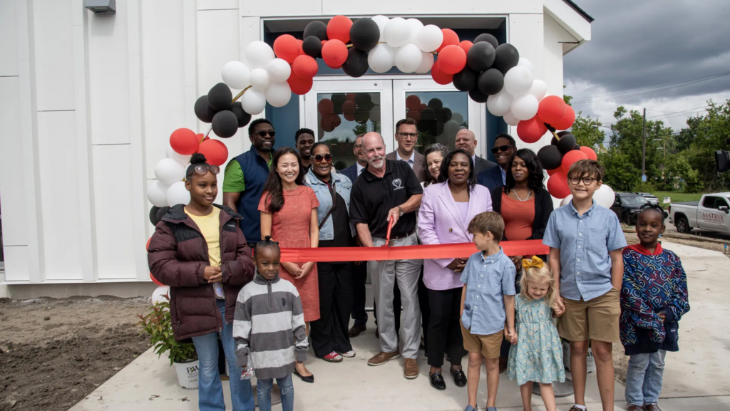 Brad Coulter, CEO of Matrix Family Services, cuts the ribbon for the new McClellan Early Childhood Center in Detroit, Aug. 20, 2024.