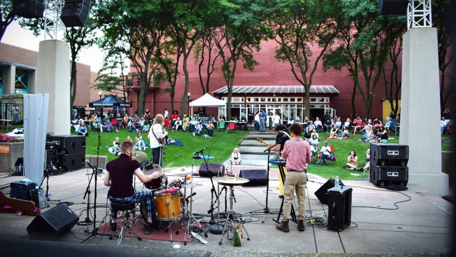 A band gets ready to play onstage at New Center Park.