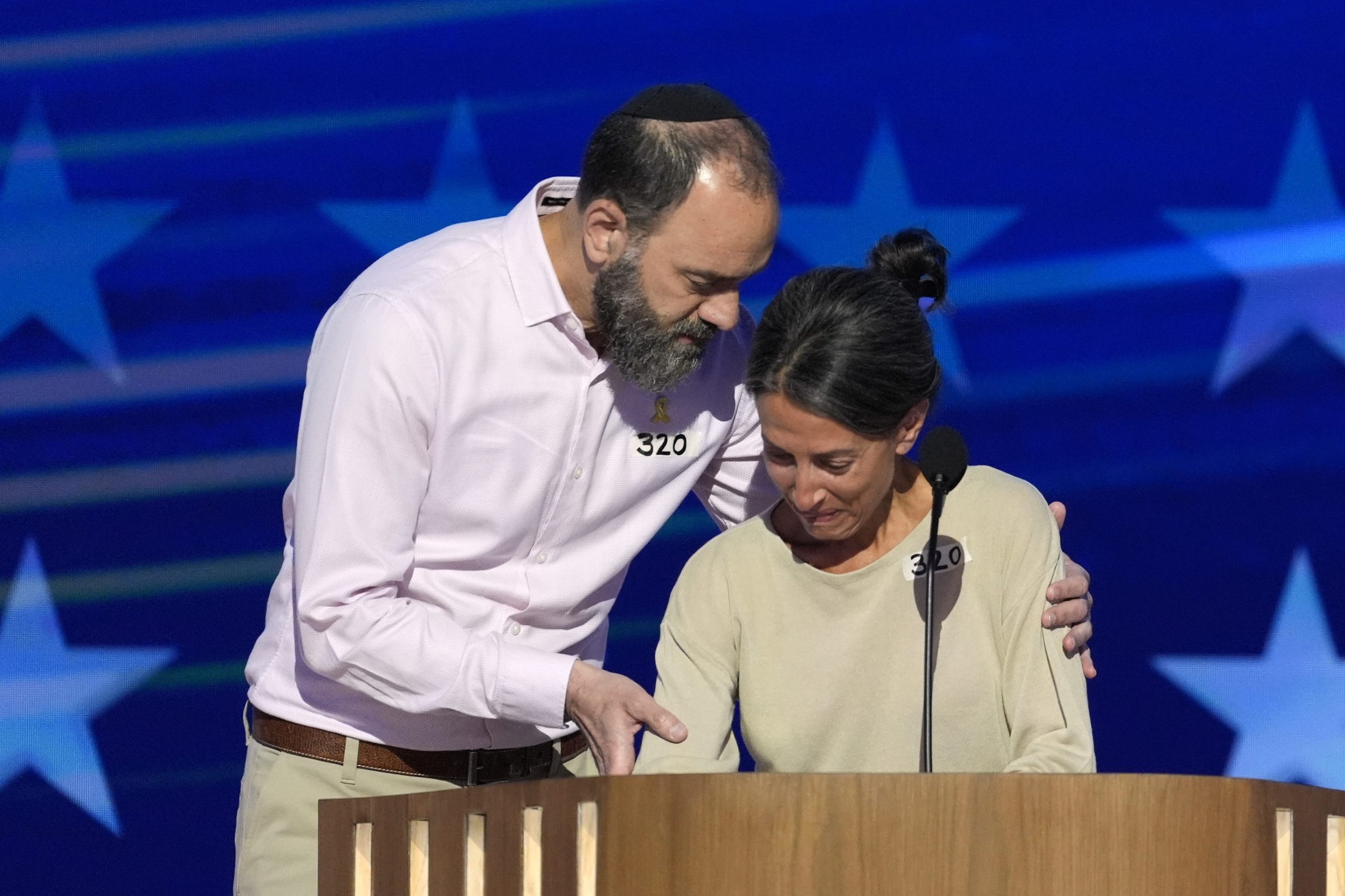 Jon Polin, left, and Rachel Goldberg, parents of Hersh Goldberg-Polin, speak on stage during the Democratic National Convention Wednesday, Aug. 21, 2024, in Chicago.