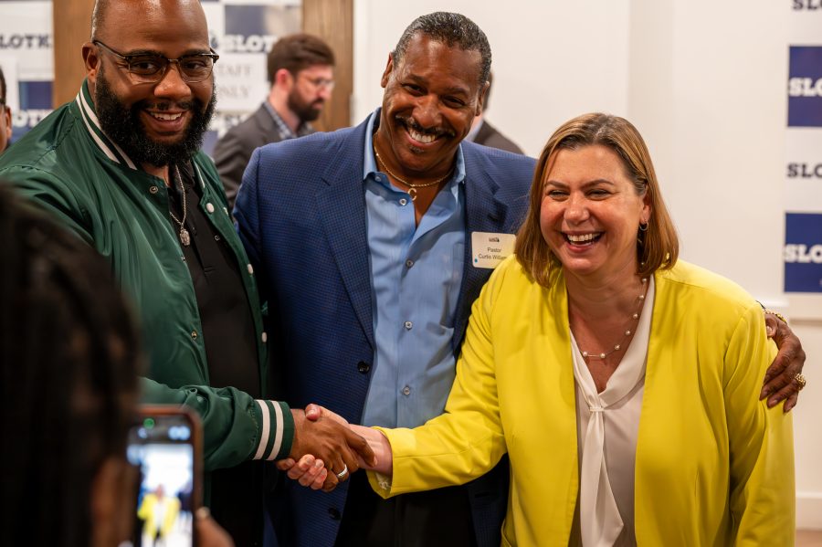 U.S. Congresswoman Elissa Slotkin poses with supporters after her victory against actor Hill Harper in the Aug. 6 primary race for a U.S. Senate seat in Michigan.