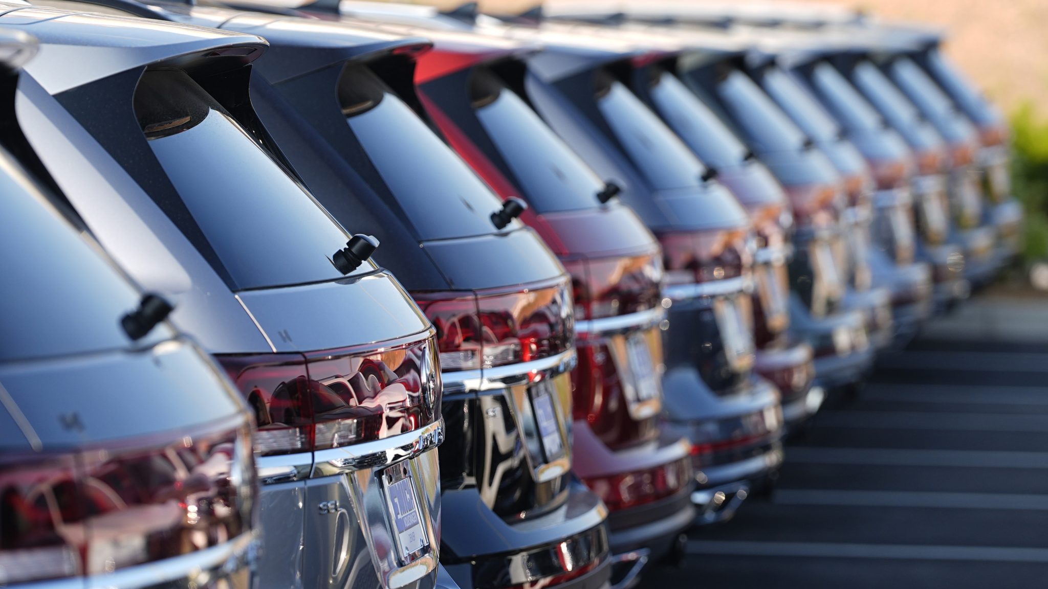 A long row of unsold 2024 Atlas utility vehicles is shown Sunday, July 28, 2024, at a Volkswagen dealership in Denver.