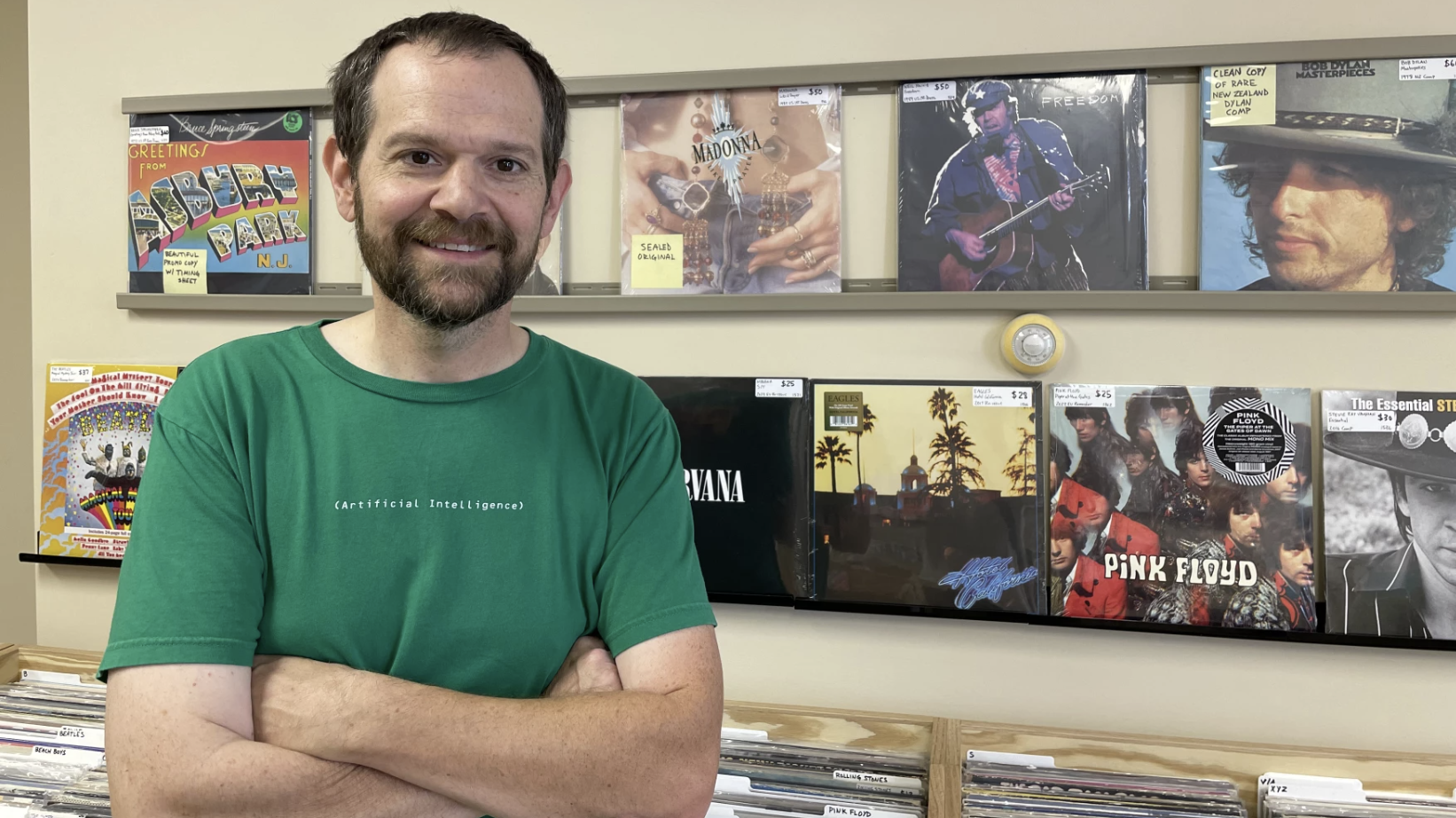 Hexagon Records owner Mike Griggs stands in front of the racks at his store on Howard Street in Petoskey.