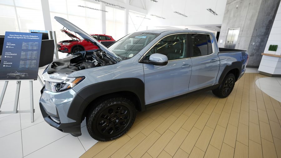 Unsold 2025 Ridgeline pickup truck sits on display in the showroom of a Honda dealership Wednesday, Sept. 4, 2024, in Highlands Ranch, Colo.