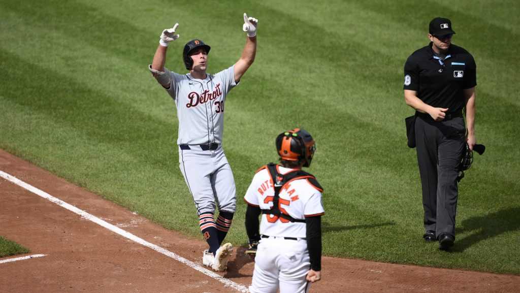 Detroit Tigers' Kerry Carpenter, left, celebrates after his home run in front of Baltimore Orioles catcher Adley Rutschman (35) during the sixth inning of a baseball game, Sunday, Sept. 22, 2024, in Baltimore.