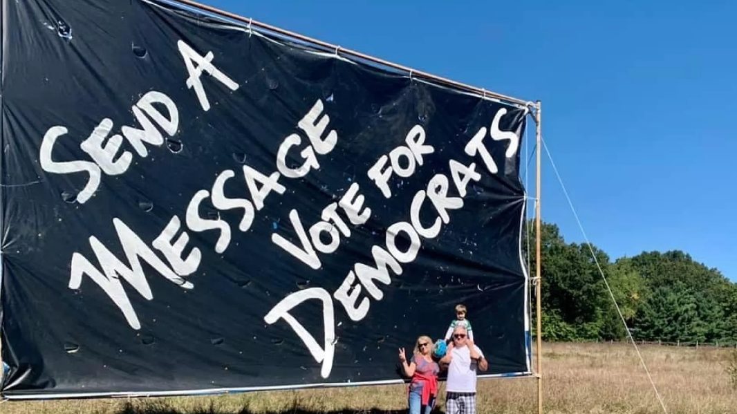 A large tarp sign put up by the Beacham family in 2020 near Lawton, Mich.