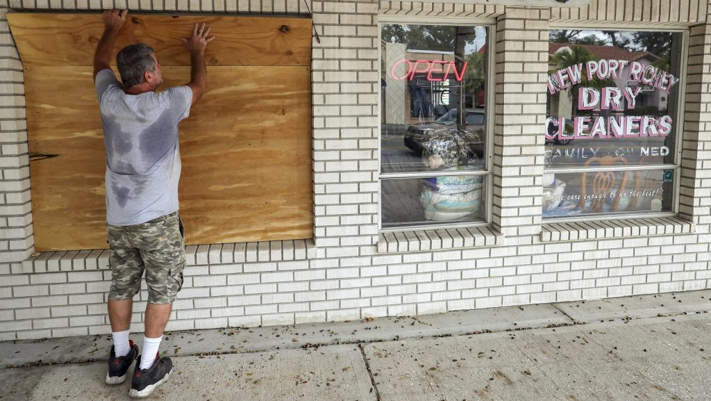 Jay McCoy puts up plywood in preparation for Hurricane Milton on Monday, Oct. 7, 2024, in New Port Richey, Fla.