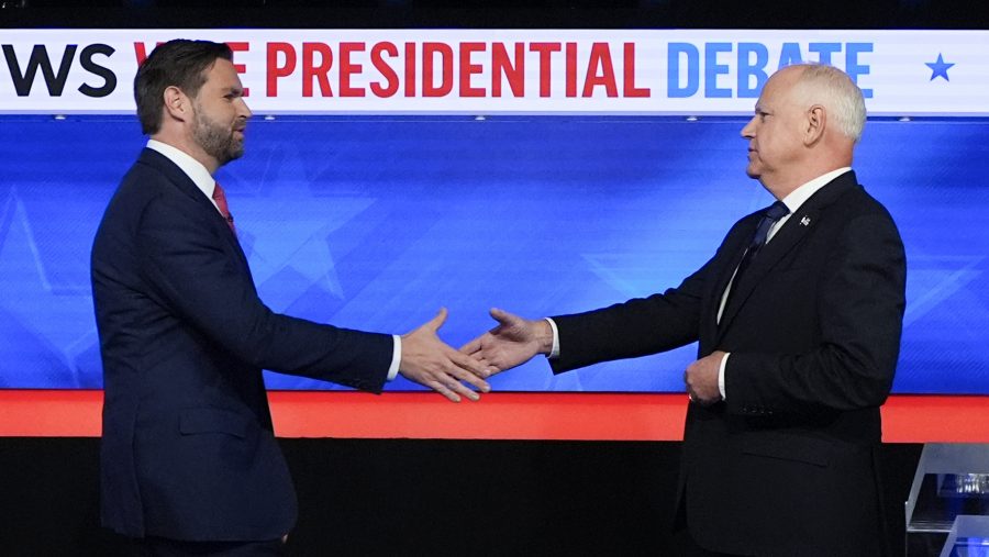 Republican vice presidential nominee Sen. JD Vance, R-Ohio, left, and Democratic vice presidential nominee Minnesota Gov. Tim Walz, shake hands as they arrive for a CBS News vice presidential debate, Tuesday, Oct. 1, 2024, in New York.