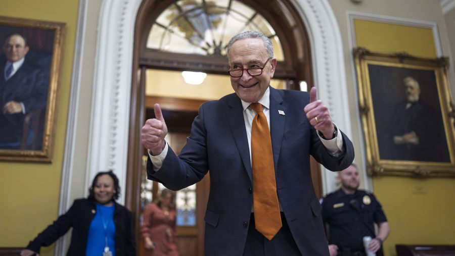 Senate Majority Leader Chuck Schumer, D-N.Y., celebrates as the Senate begins voting on the government funding bill just in time to meet the midnight deadline, at the Capitol in Washington, Friday, Dec. 20, 2024.