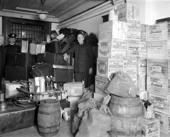 Police officers confiscating liquor during the Prohibition era in Detroit.