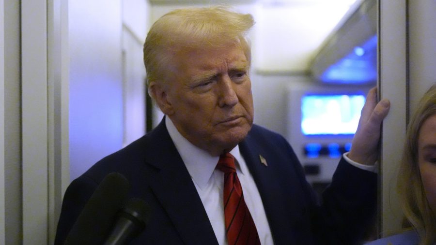 President Donald Trump speaks to reporters aboard Air Force One en route from Miami to Joint Base Andrews, Md., Monday, Jan. 27, 2025.