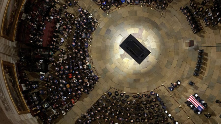 The flag-draped casket of former President Jimmy Carter is carried by a joint services body bearer team into U.S. Capitol Rotunda where he will lie in state, Tuesday, Jan. 7, 2025, in Washington.