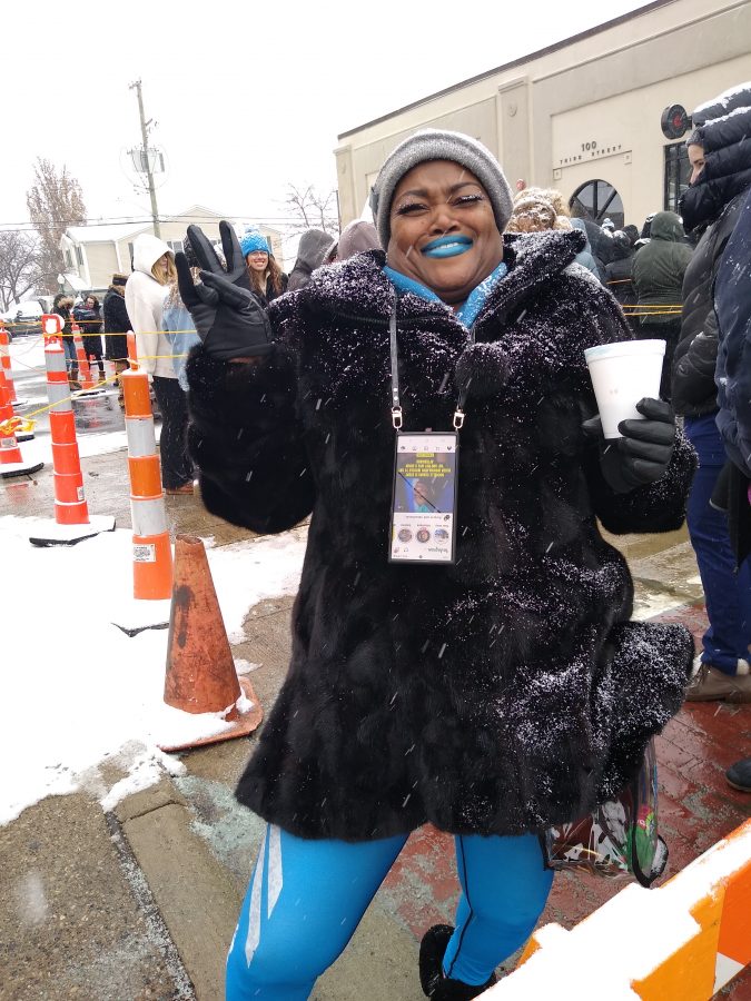 Lions fan Keena Benning-Dehnke waits outside The Home Bakery in Rochester.