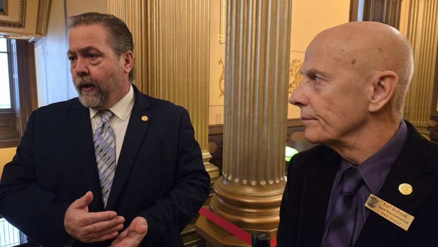 State Rep. Karl Bohnak (left) and Rep. David Prestin discuss RICE generator legislation.