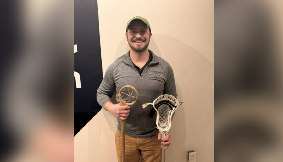 Detroit lacrosse coach Liam McElroy holds traditional and contemporary lacrosse sticks at WDET Studios, Monday, March 3, 2025.