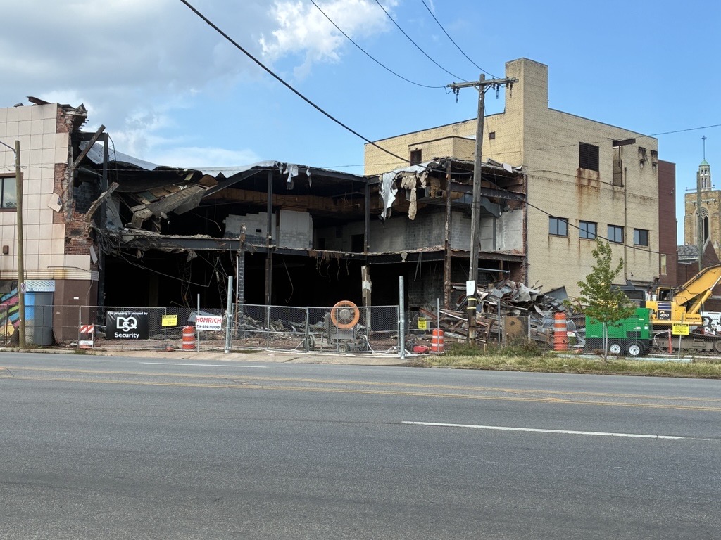 Demolition exposes the inside of the abandoned Mammoth department store