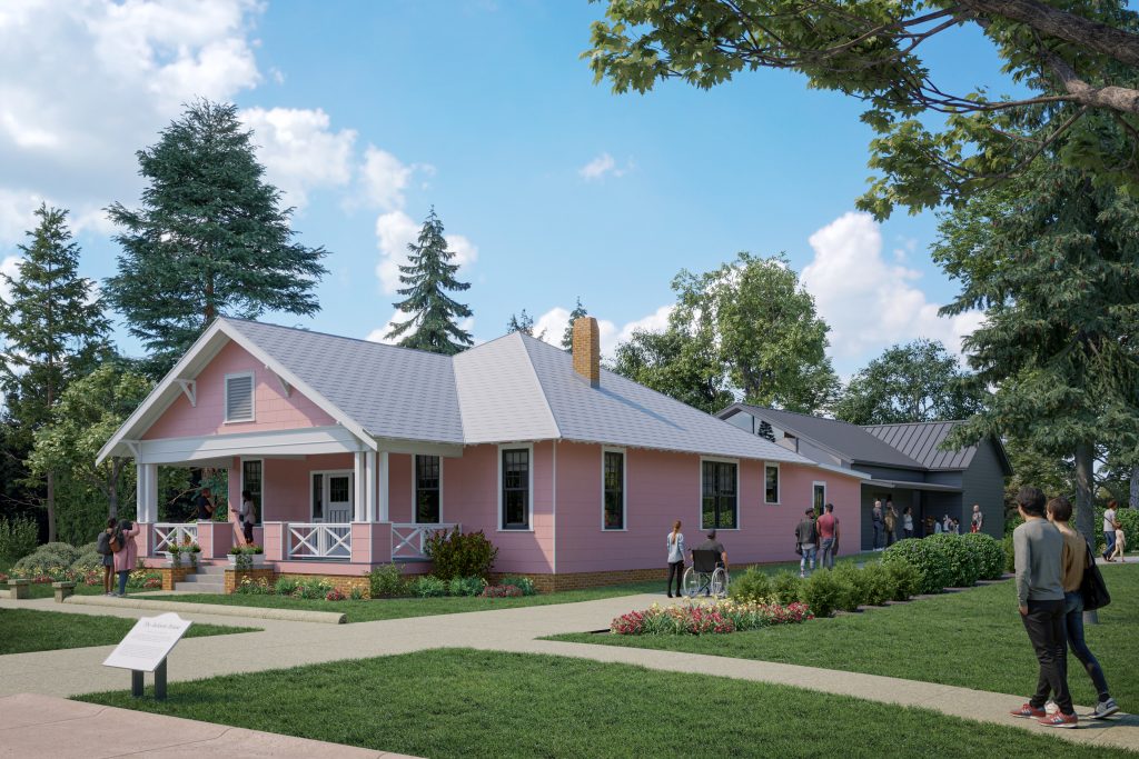 A pink arts and crafts style bungalow home with green grass.
