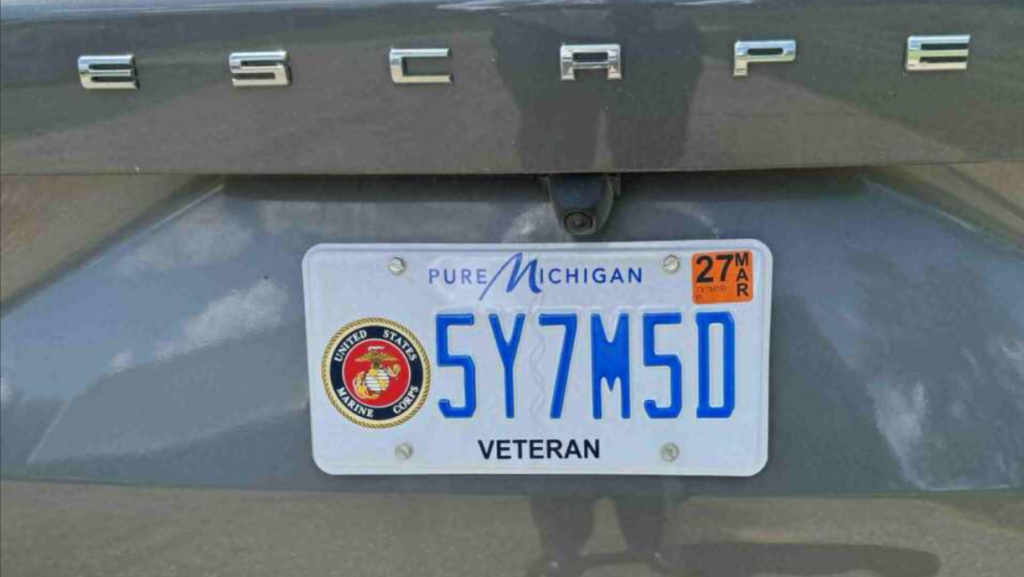 Licence plate showing Whelan's lenghth being held. 5Y7M5D