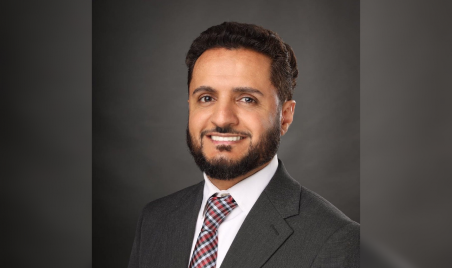 Adam Alharbi, Hamtramck Mayoral candidate, wears a suit and tie.