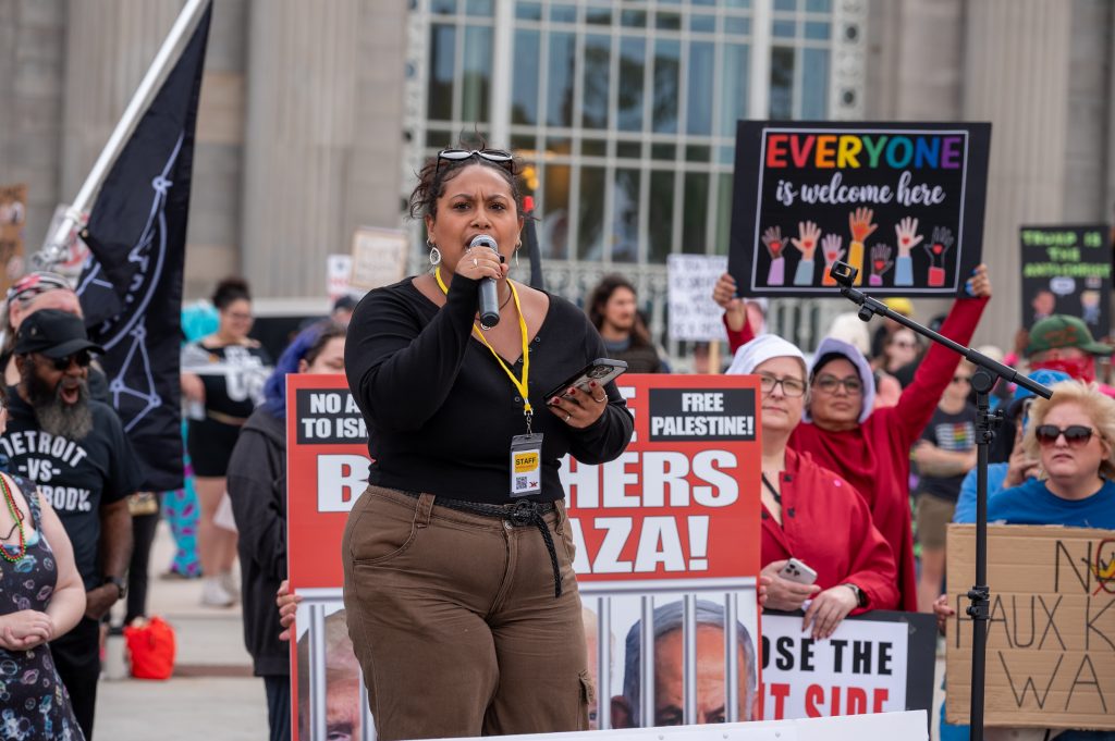 Kassandra Rodriguez speaks at a Detroit protest