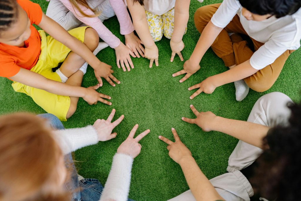 Children sit in a circle