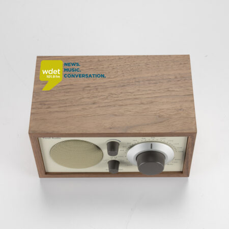 Image of a radio with a wood covering.